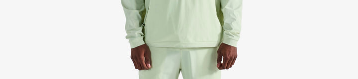 PERFORMANCE QUARTER ZIP SHELL PULLOVER