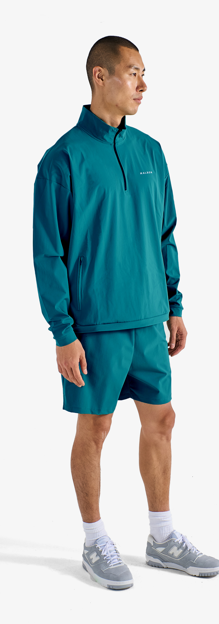 PERFORMANCE QUARTER ZIP SHELL PULLOVER