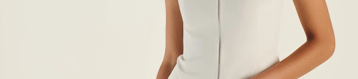 GEMMA ZIP SLEEVELESS POLO